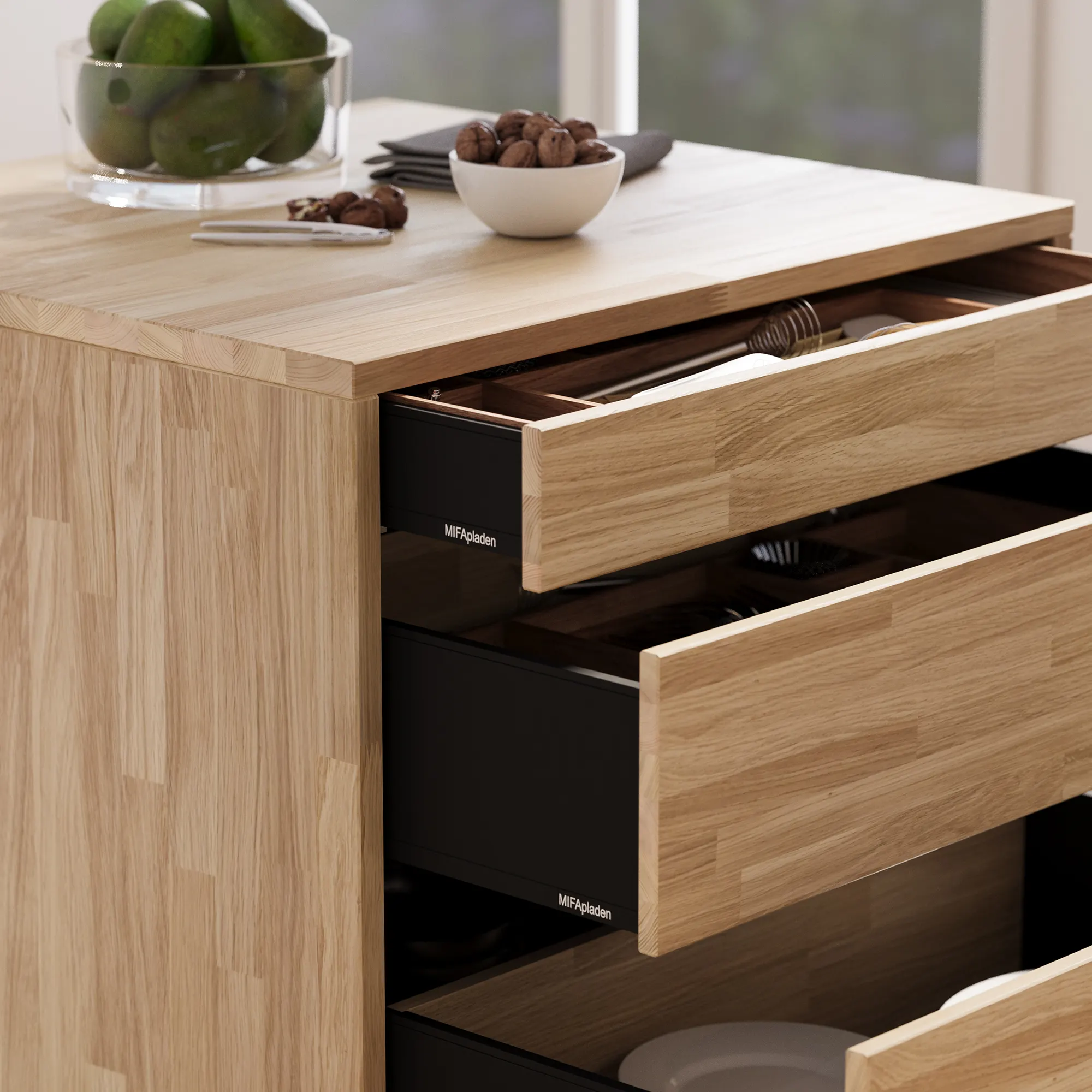 Timber drawer fronts on black carcasses, fitted trays